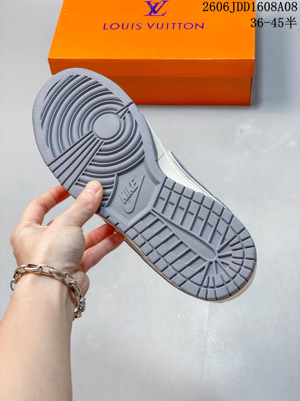 Underside of a sneaker showing a gray tread outsole