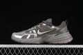 Side view of silver-gray Nike V2K Run sneakers with metallic-look overlays and a chunky sole