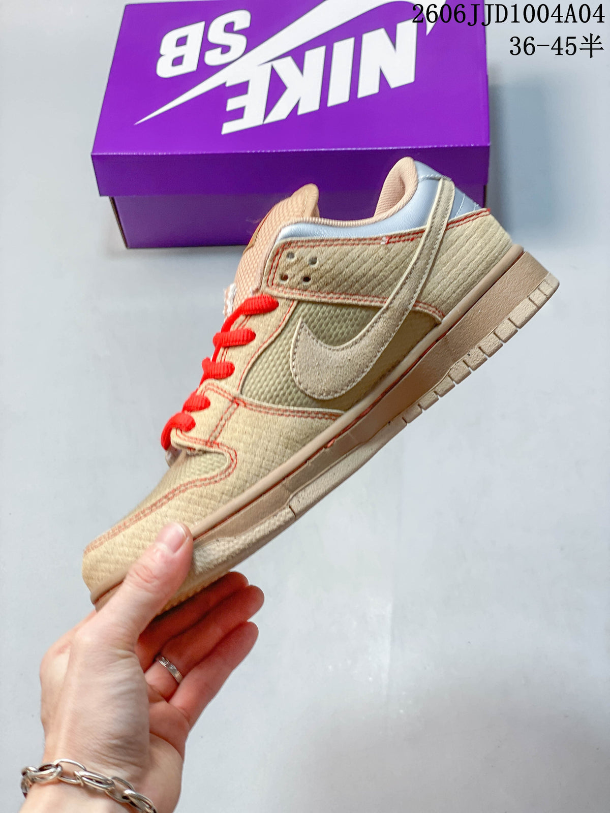 Side profile showing the tan upper, contrasting stitching and Nike Swoosh