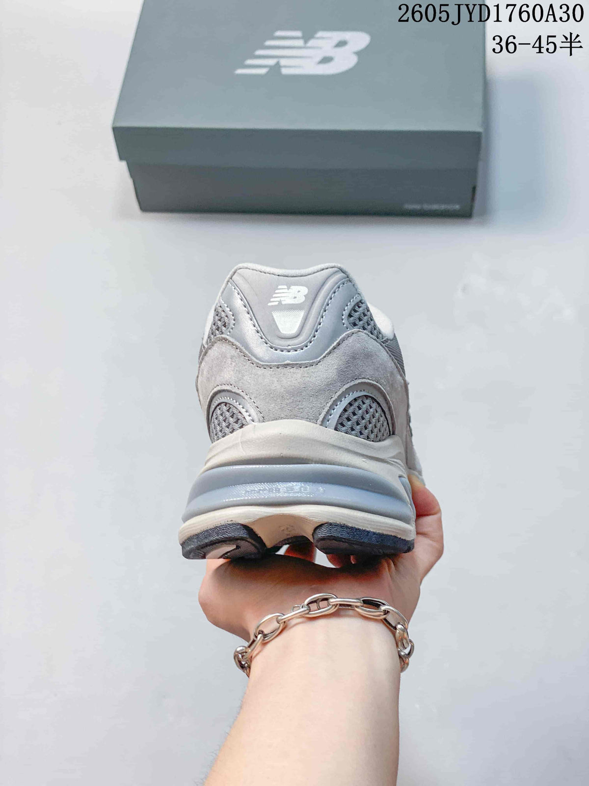 Rear view showing the heel and layered sole of a grey New Balance 2010 sneaker