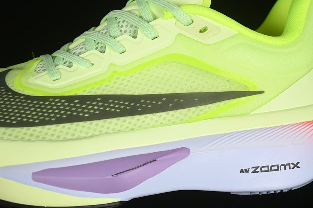 Close-up of the mesh upper, lace area, side Swoosh, and sole detailing.