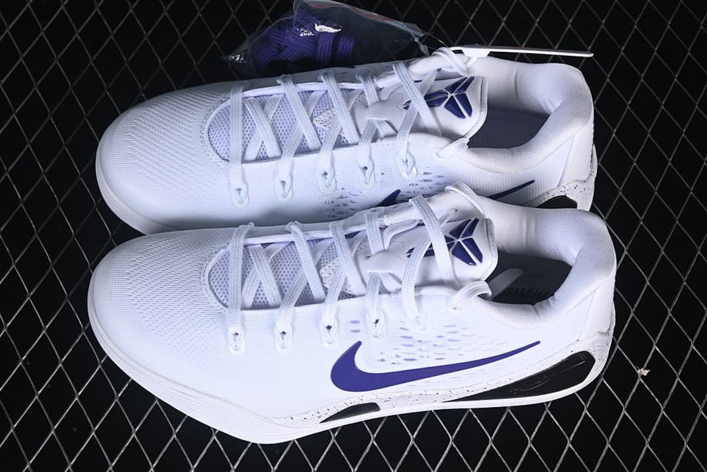 Pair of white and purple low-cut basketball shoes viewed from above