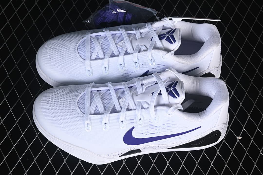 Pair of white and purple low-cut basketball shoes viewed from above