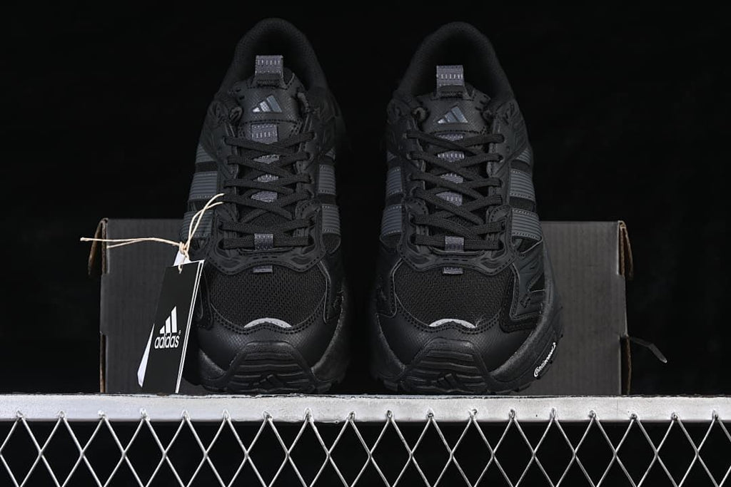 Front view of the pair of black sneakers