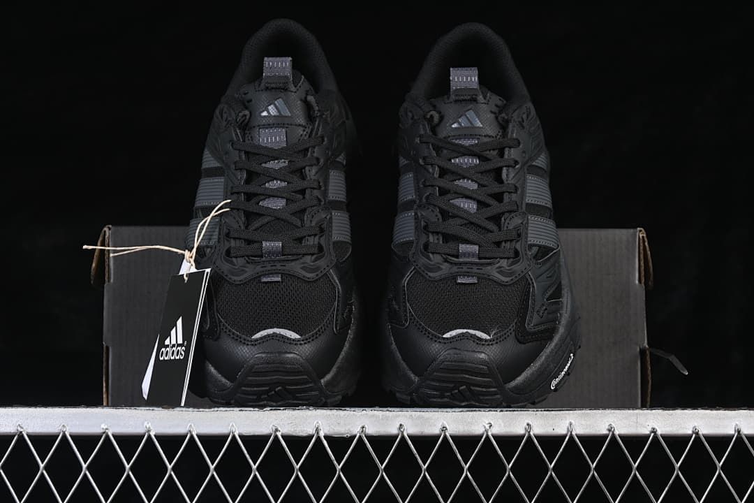 Front view of the pair of black sneakers