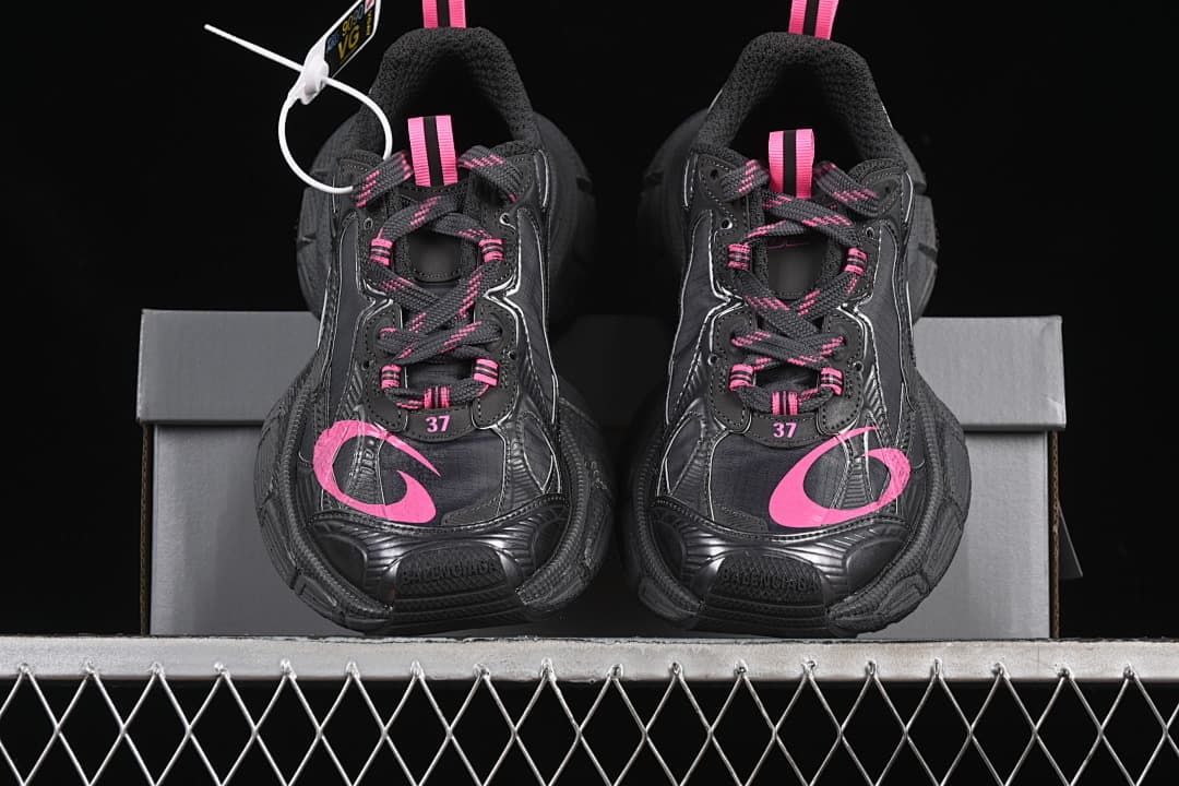 Front view of the pair showing pink details and chunky soles.