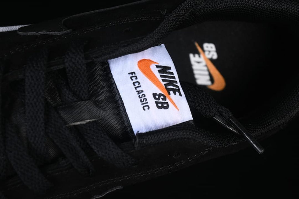 Close-up of the Nike SB FC Classic tongue label and black laces.