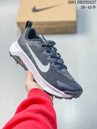 Dark gray Nike trail running shoe with a white Swoosh, white midsole, and dark outsole.
