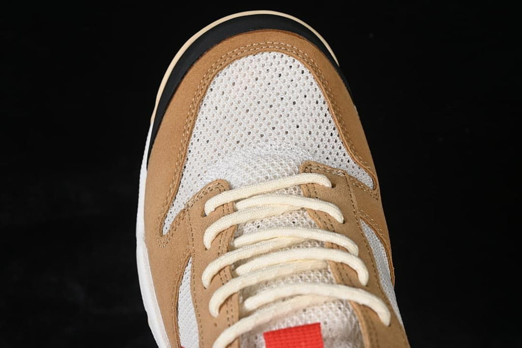 Top view of the mesh toe box, tan overlays, and cream laces