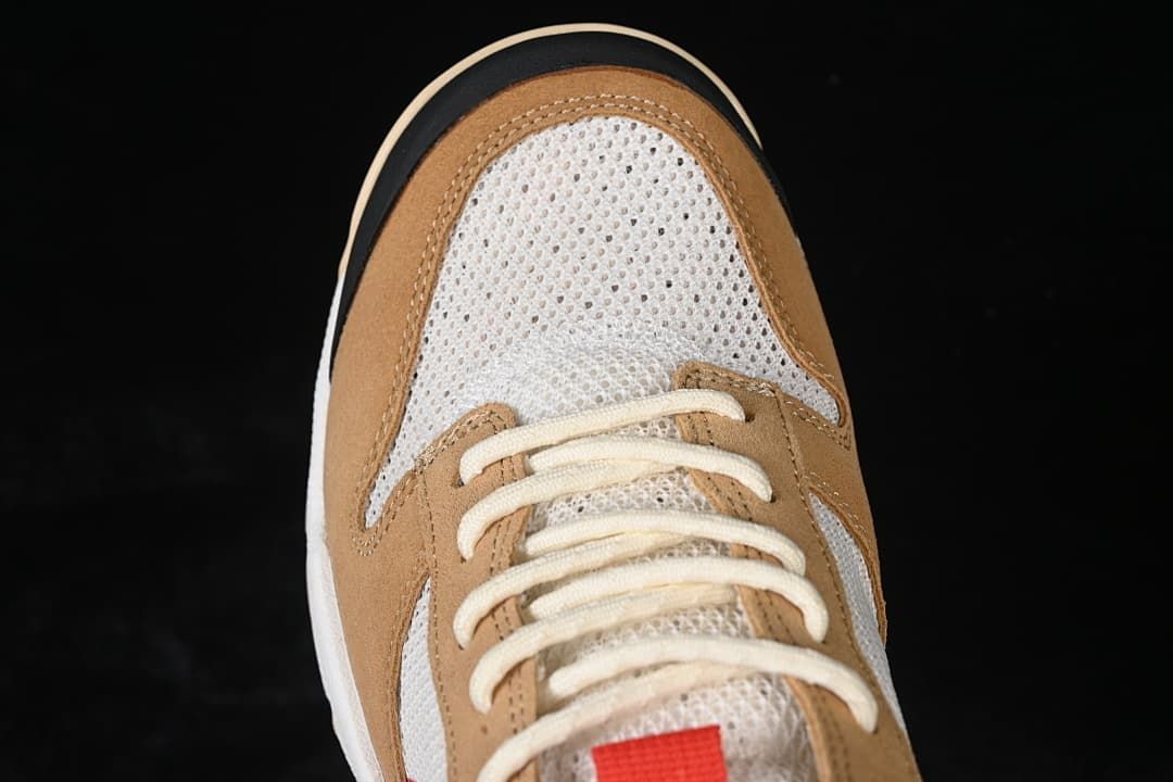 Top view of the mesh toe box, tan overlays, and cream laces