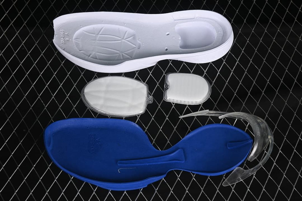 Disassembled shoe components displayed separately, including a blue footbed and translucent pieces