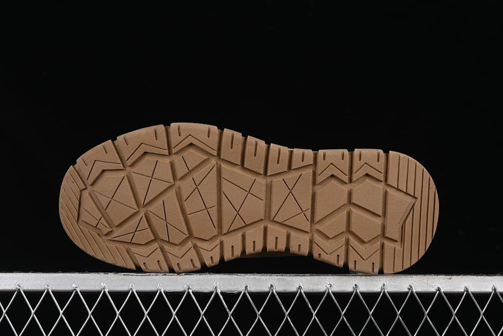 Underside view of the outsole with geometric tread.
