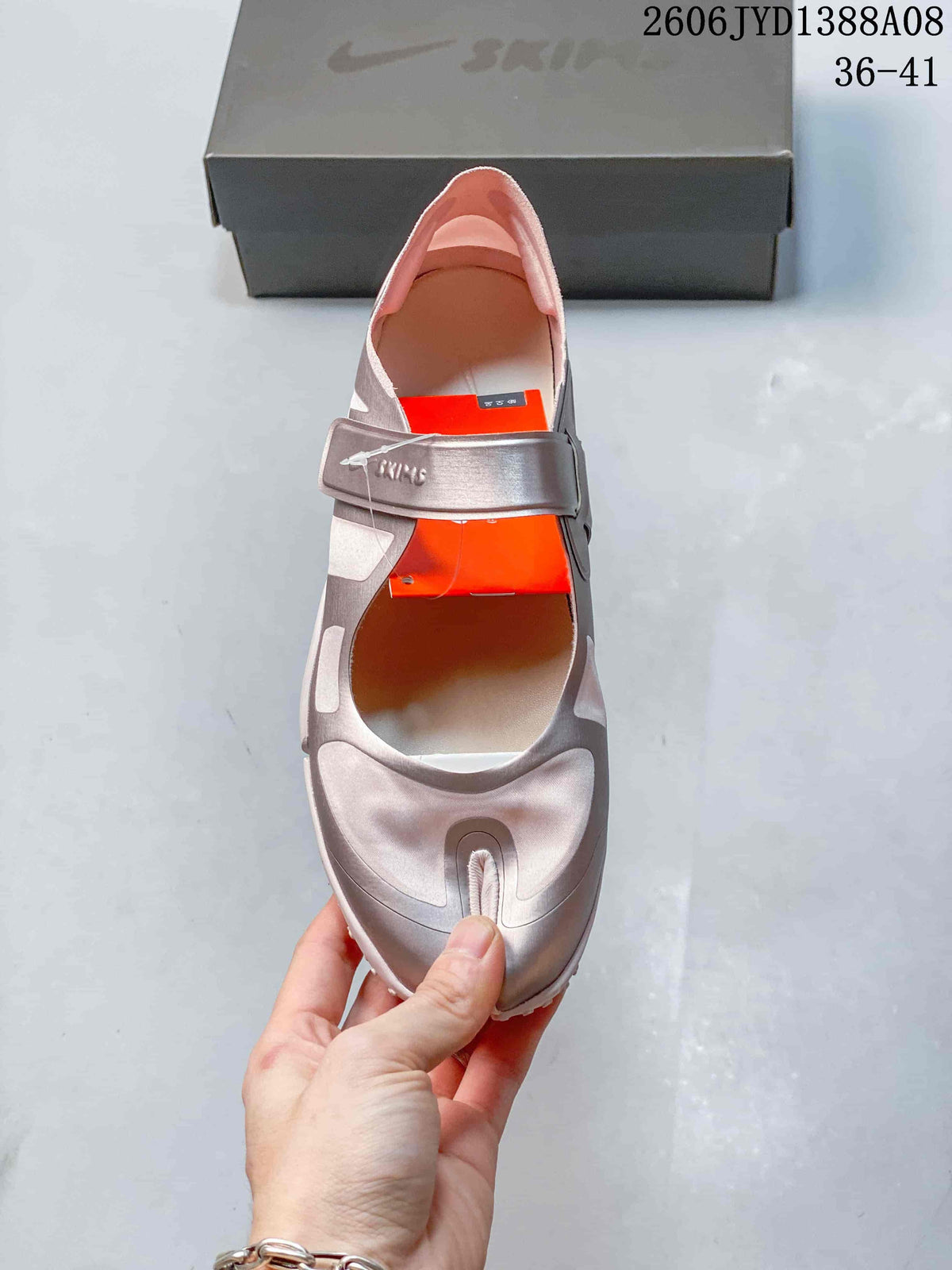 Top view of a Nike Air Rift shoe with a wide strap and split toe