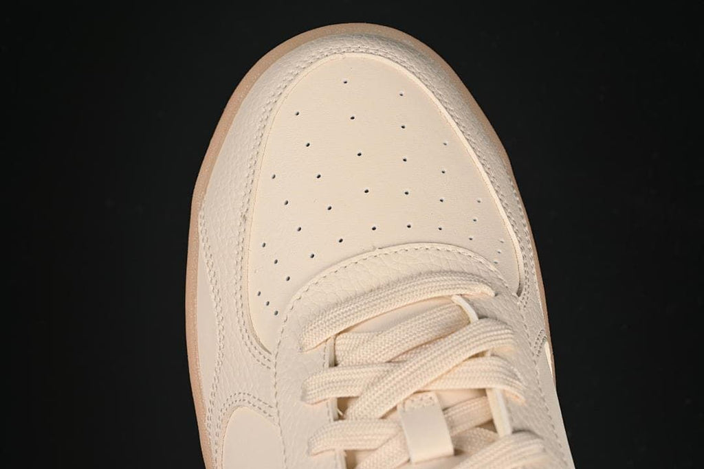 Top-down close-up of the perforated toe and laces