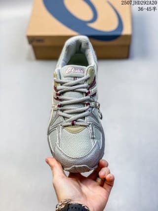 Front view of the gray ASICS Gel-Kahana 8 FL sneaker showing the laces, toe panel and layered upper.