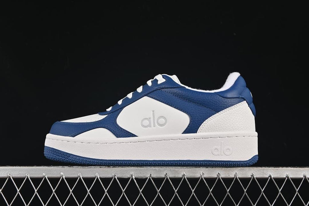 Side view of navy and white Alo Recovery Mode low-top sneakers