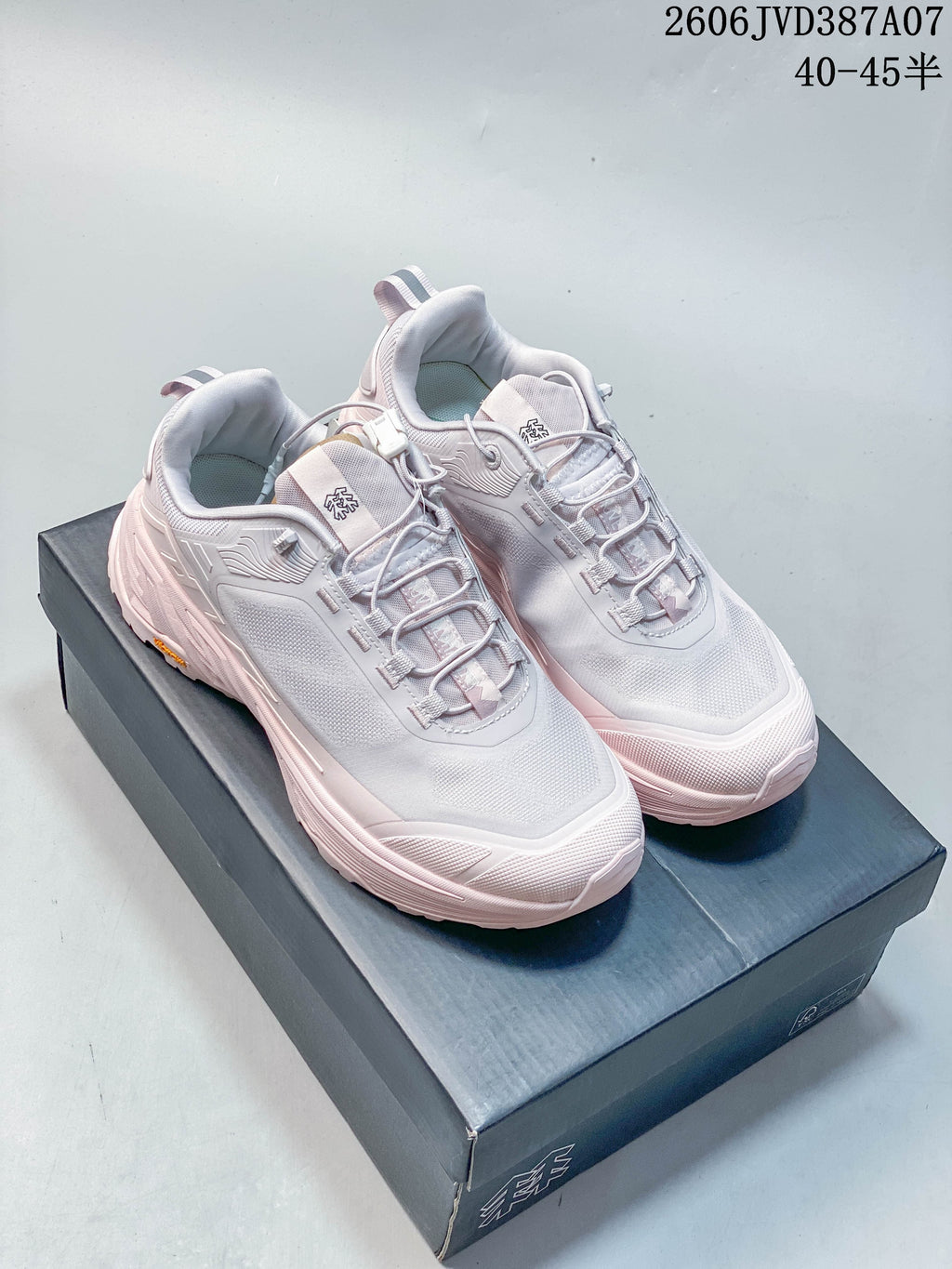 Pair of pale gray and pink Kolon Sport low-top sneakers viewed from above