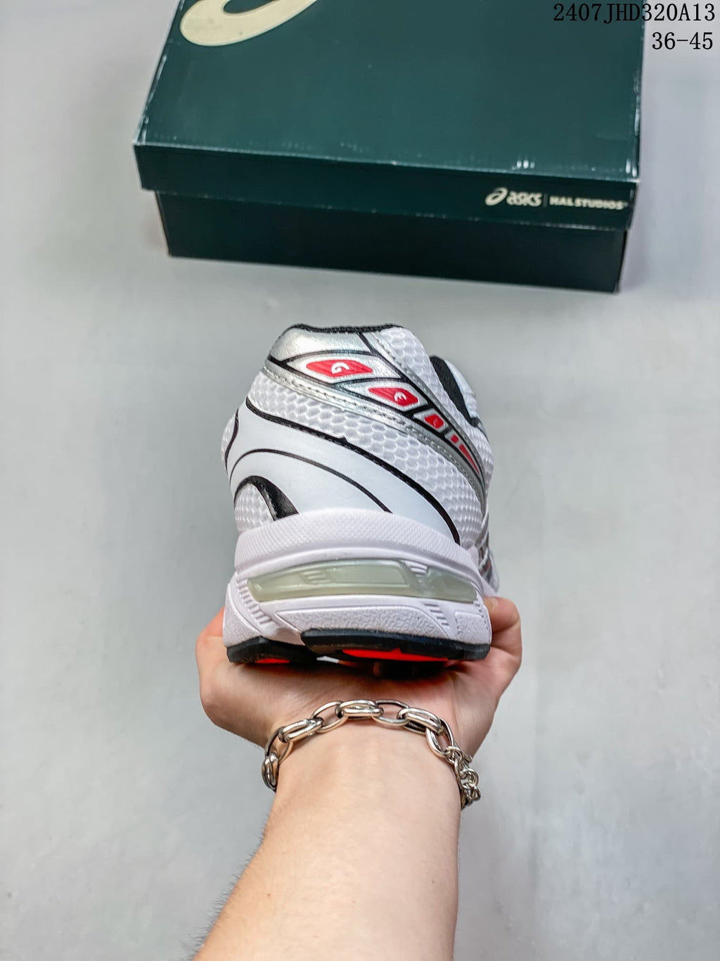 Rear view of the white sneaker with black and red heel details