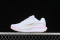 Side view of white Nike Winflo 11 running shoe with pastel accents