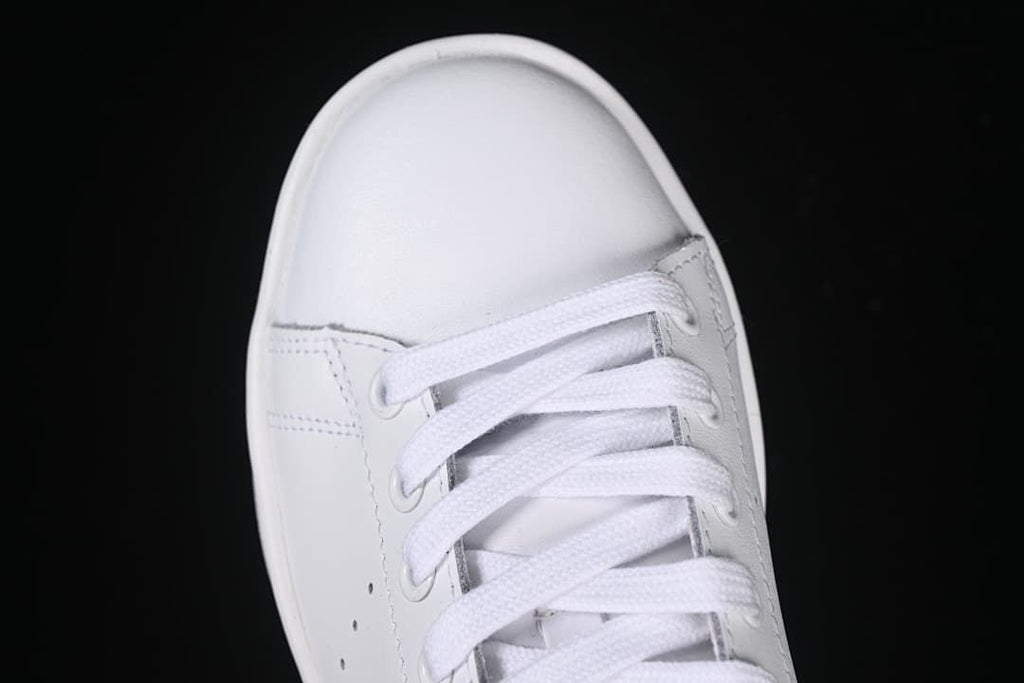 Top view of the rounded toe and white lace-up front.