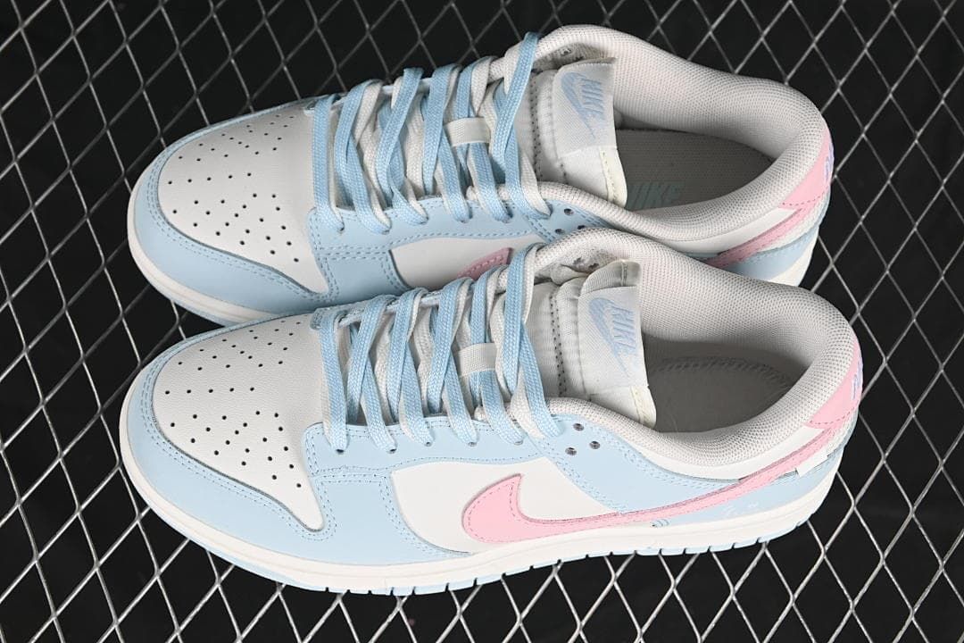 Pair of blue, white and pink low-top sneakers viewed from above
