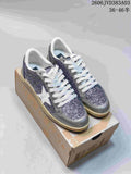 Pair of silver and glitter-panel Golden Goose Super-Star low-top sneakers on a box