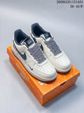 White and dark Nike Air Force 1 '07 LV8 sneakers on an orange Nike box