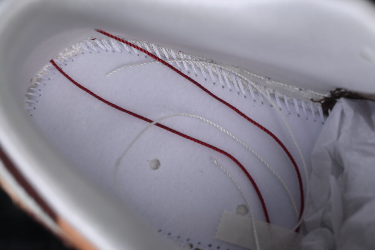 Interior view of the sneaker showing stitching and construction details.