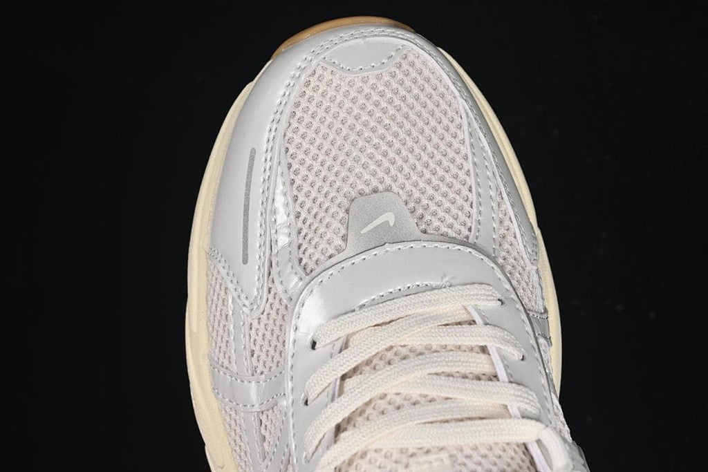 Top-down close-up of the mesh toe and lace area