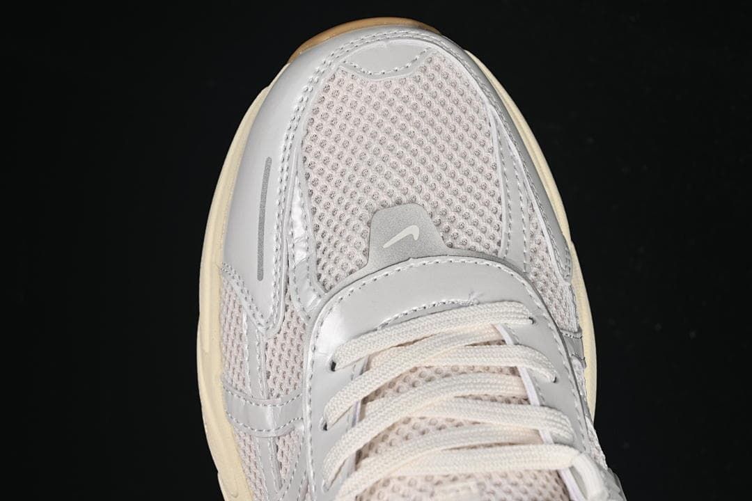 Top-down close-up of the mesh toe and lace area