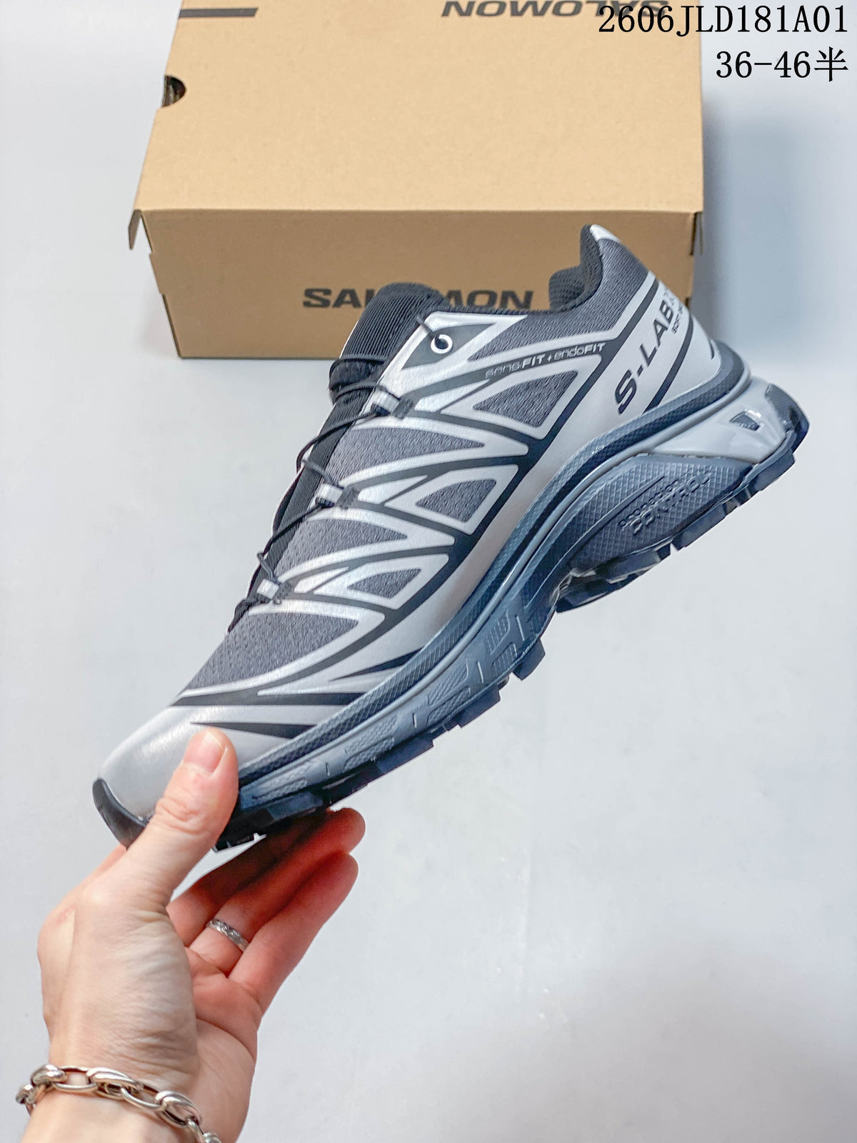 Side view showing geometric overlays and quick lacing on a Salomon XT-6 sneaker