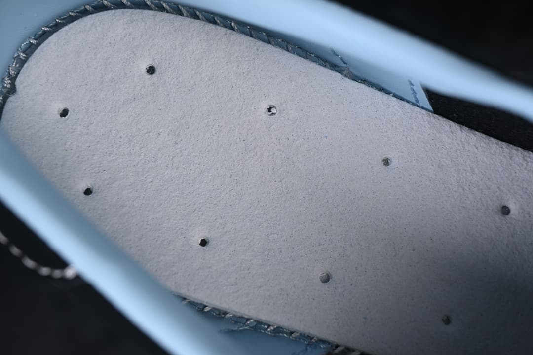 Close-up of the pale-colored underside of the shoe's insole