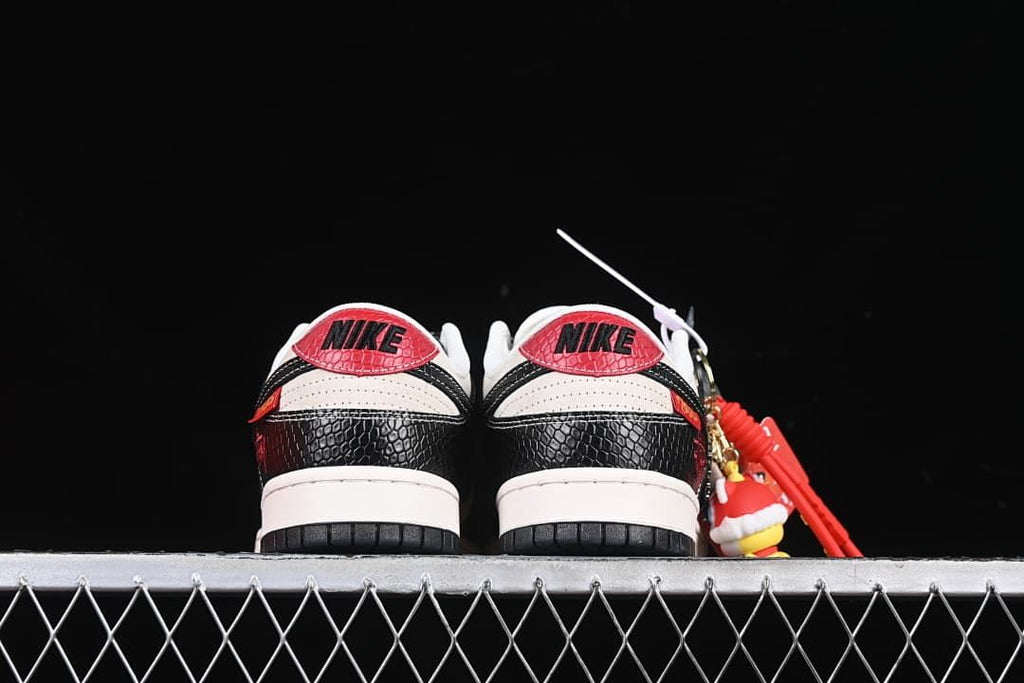 Rear view of both sneakers showing red heel tabs