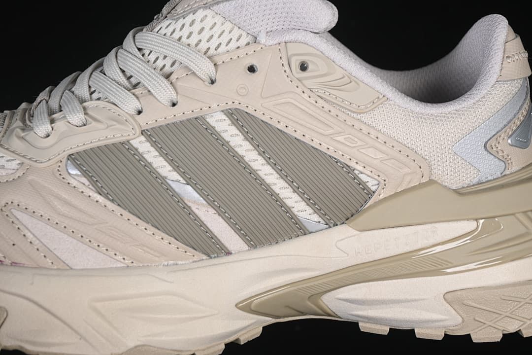 Close-up of the layered side panels, stripes and midsole