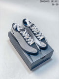 Pair of silver and navy Nike Air Superfly low-top sneakers with white decorative laces.