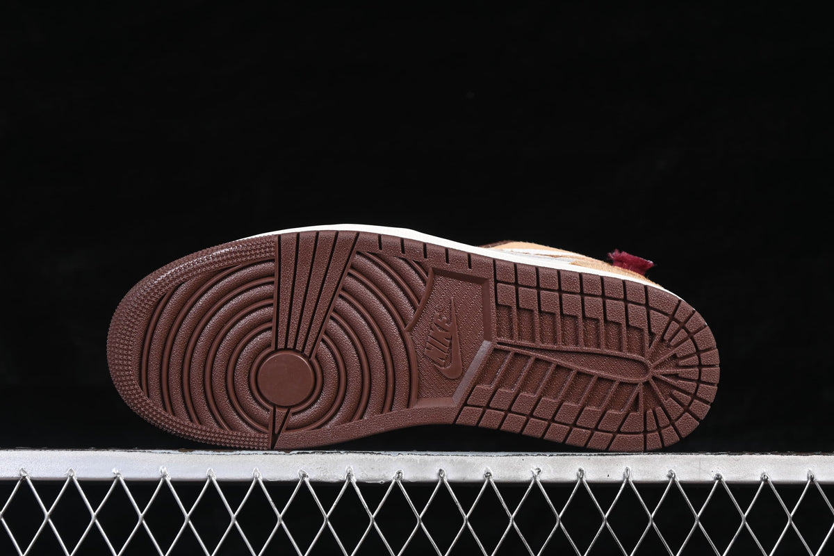 Underside view of the dark brown patterned outsole