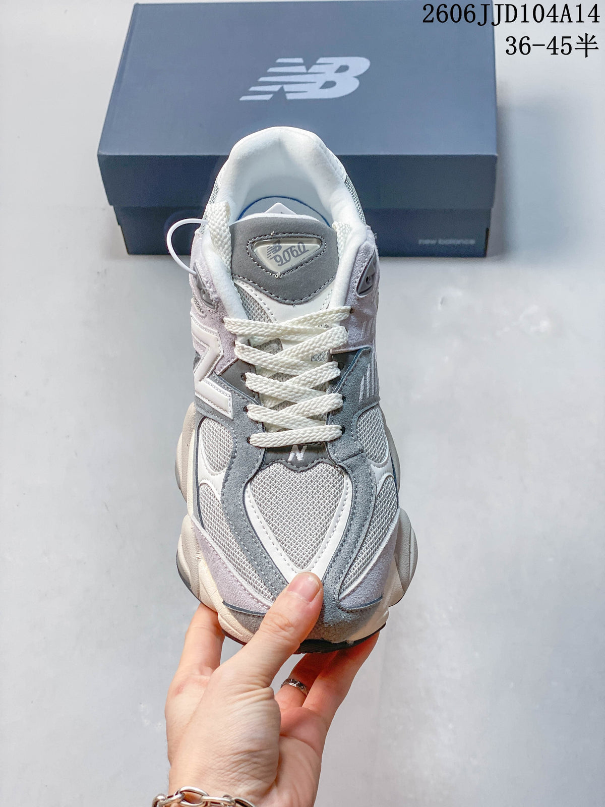 Front view of the New Balance 9060 sneaker showing its mesh panels and laces