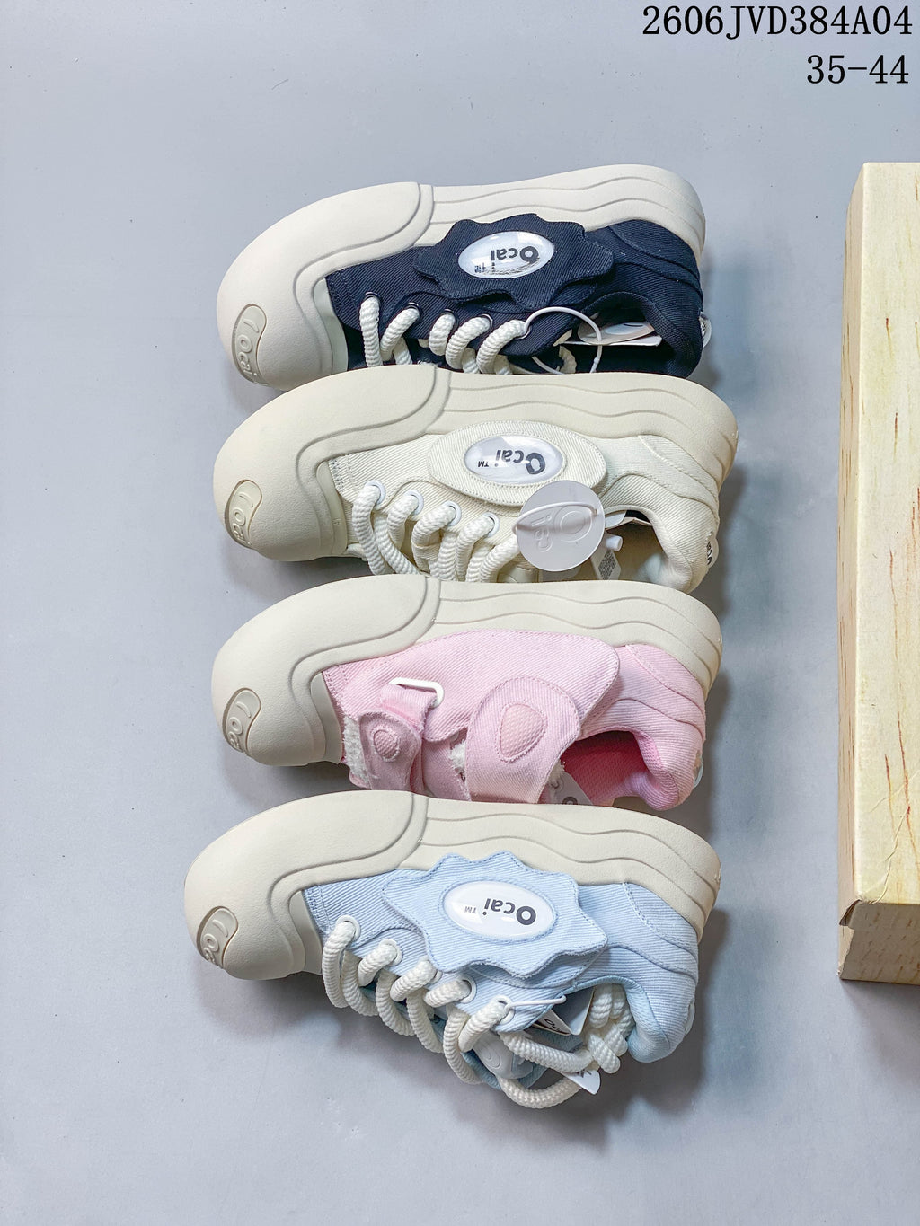 Four Ocai sneaker color options shown from the side: navy, off-white, pink, and pale blue