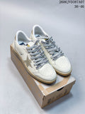 Pair of white Super-Star low-top sneakers with silver star details, gray printed laces, and distressed-look beige midsoles