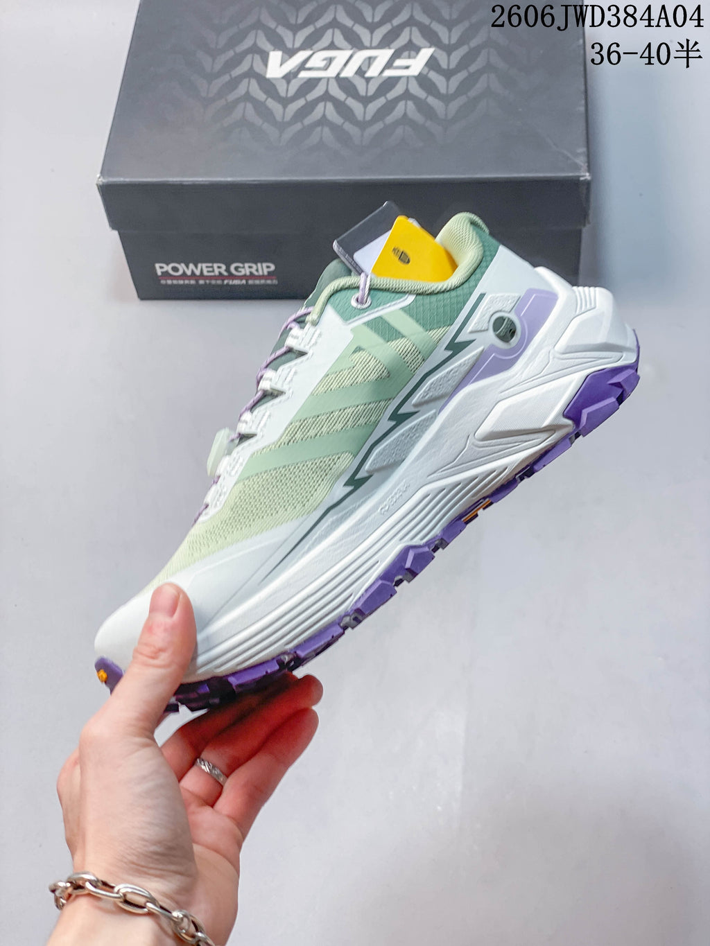 Side view of a mint green Kailas Fuga EX3 trail shoe with a dial-adjustment lace system