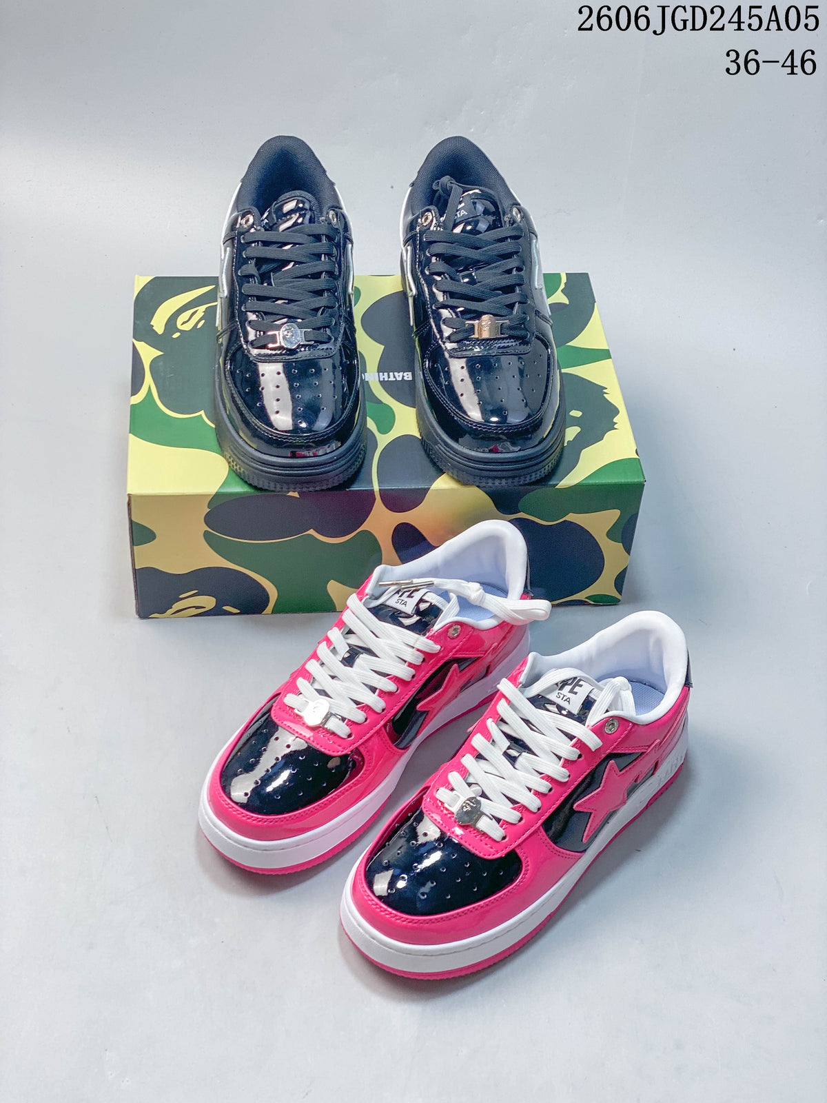 Navy and pink BAPE STA low-top sneakers shown together