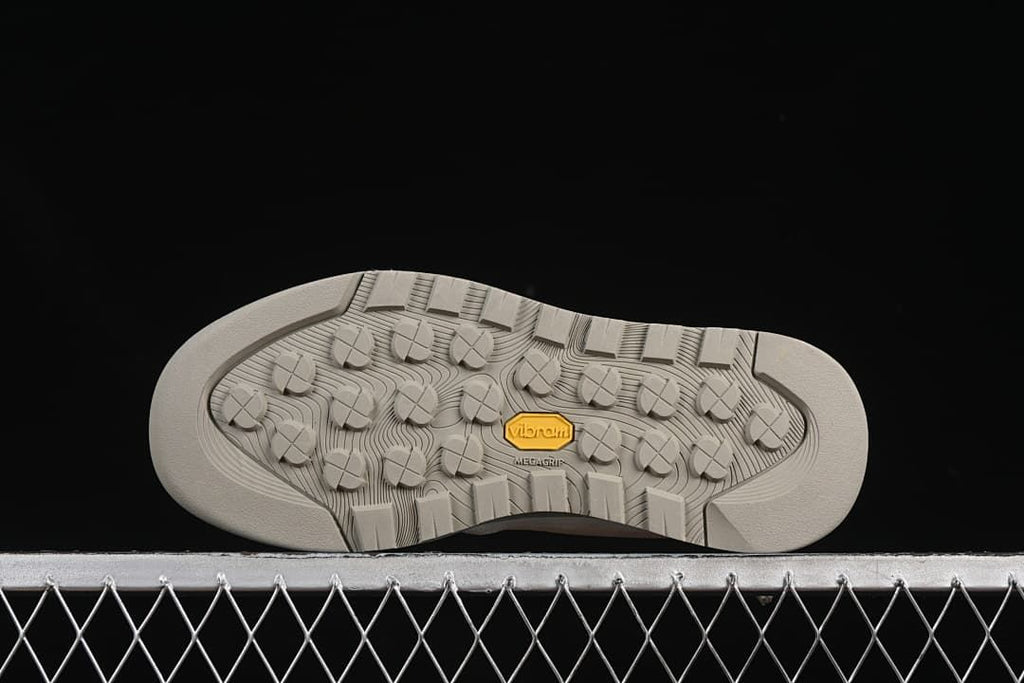 Underside view showing patterned tread and Vibram branding
