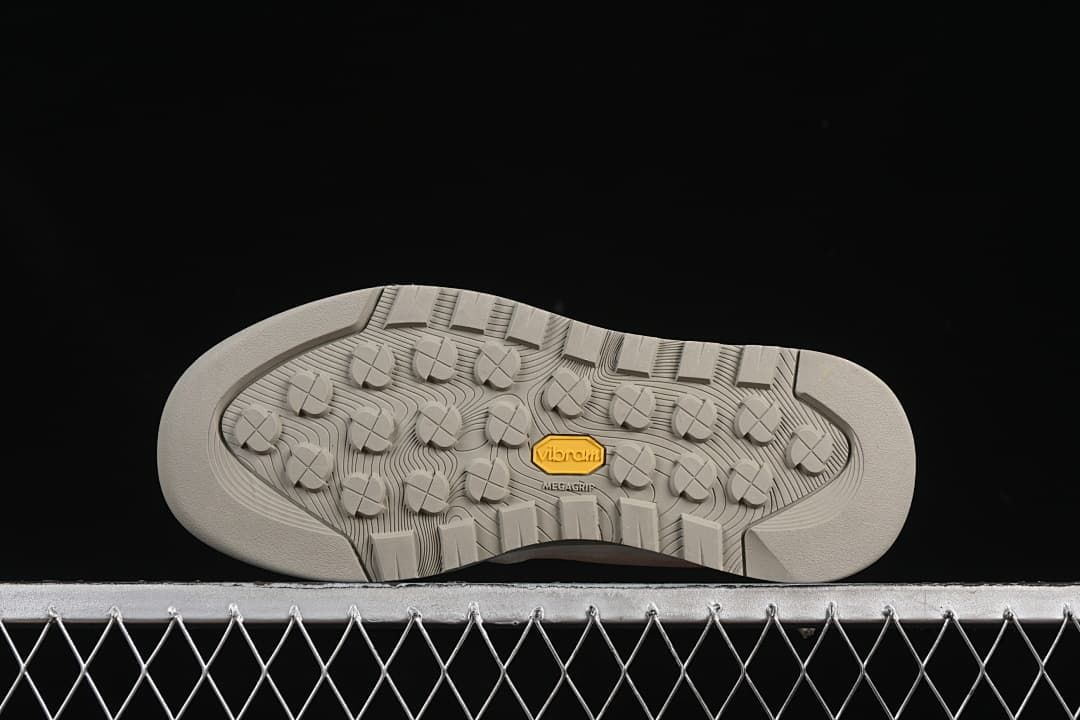 Underside view showing patterned tread and Vibram branding