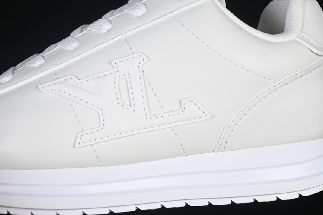 Tonal side emblem and white sole close-up
