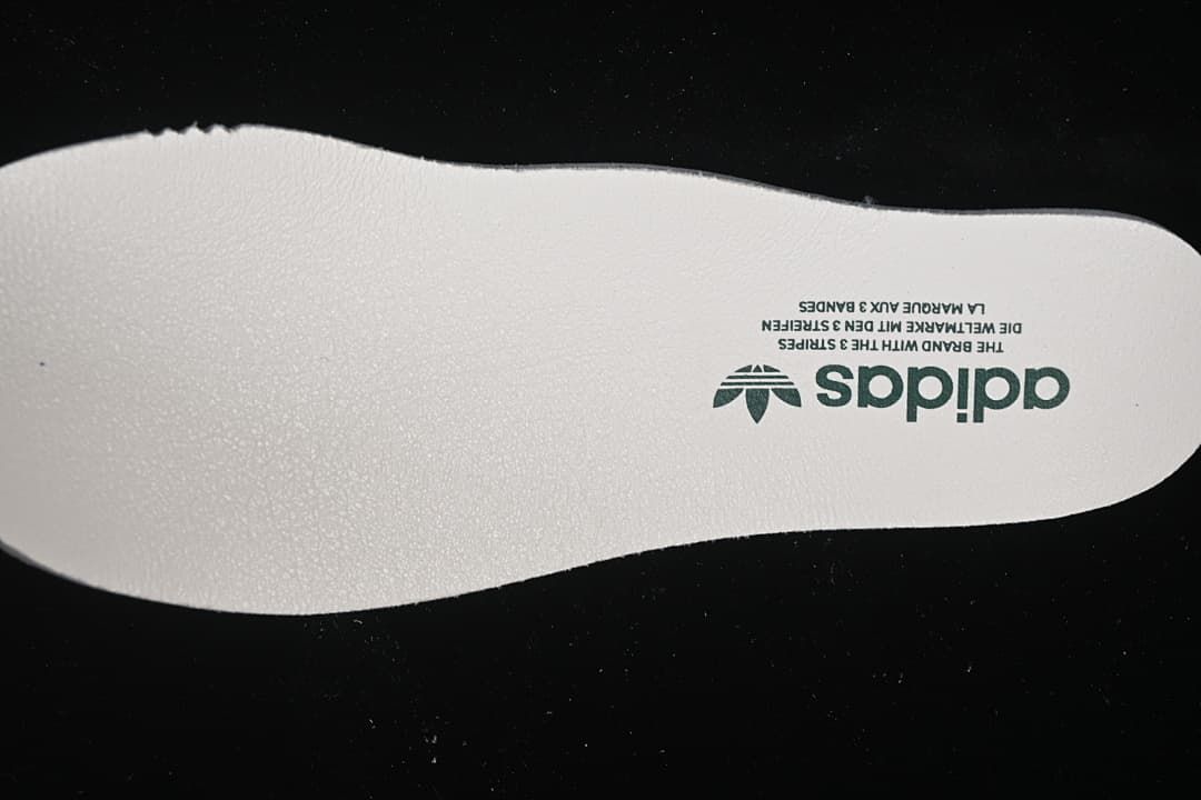 Close-up of an adidas-branded light-colored insole