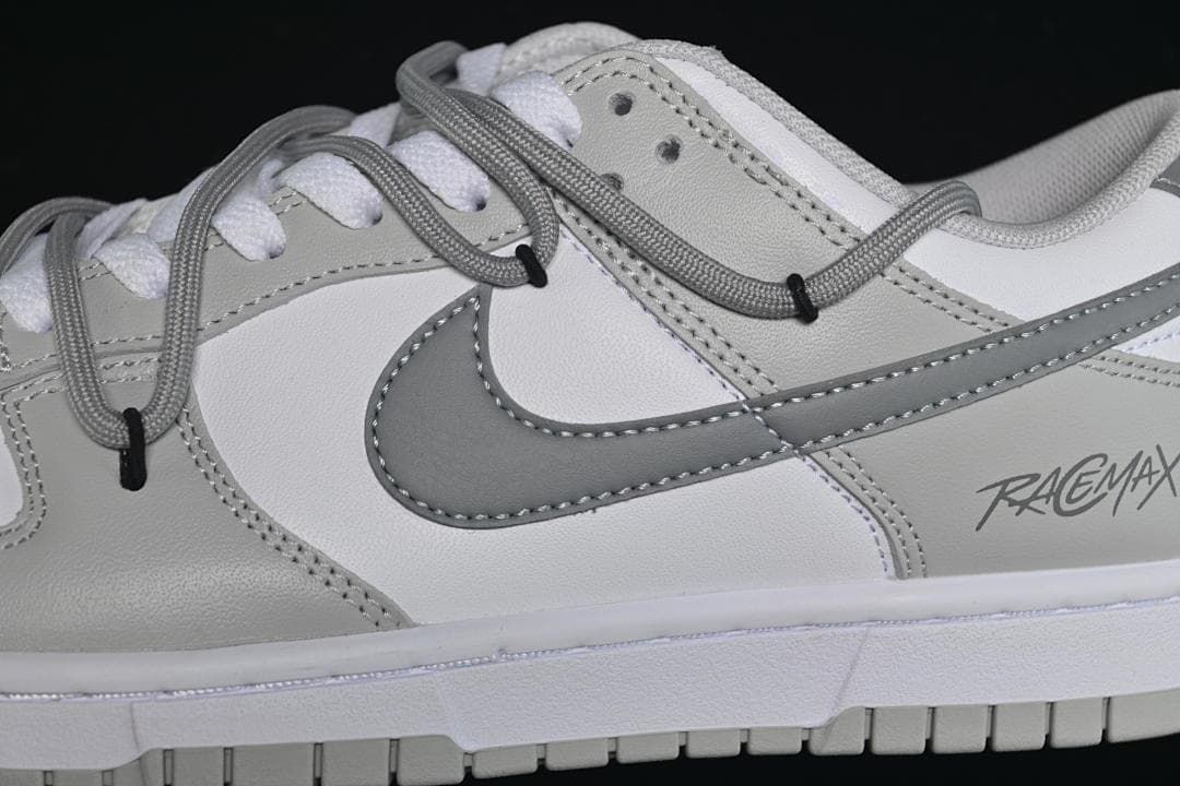 Close-up of the grey side logo and layered cord-style lacing