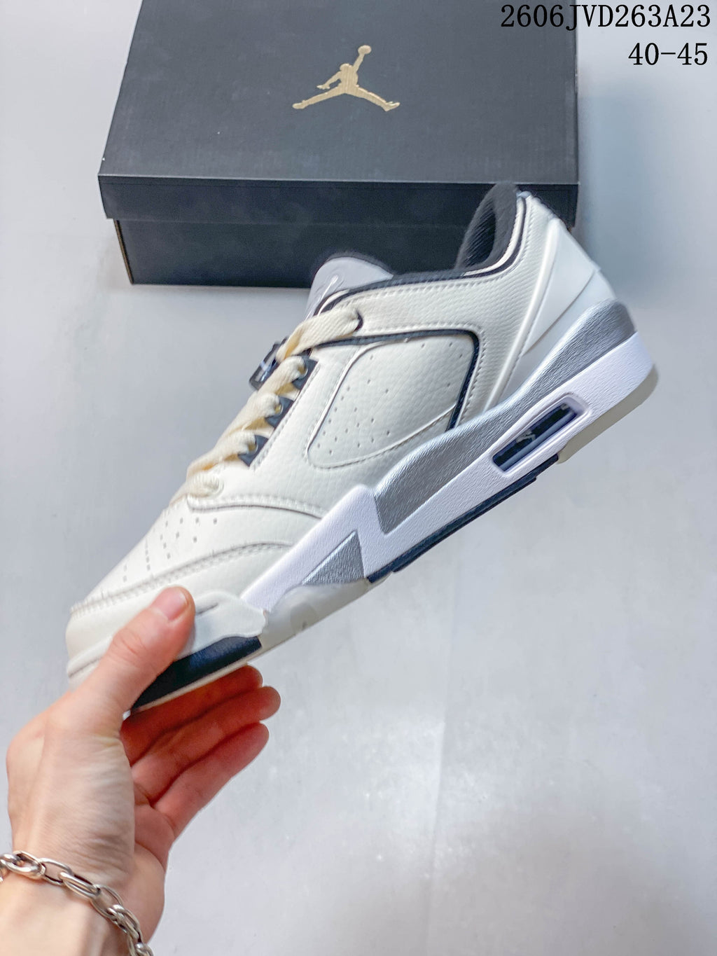 Side profile showing the perforated panels and sculpted sole of the sneaker