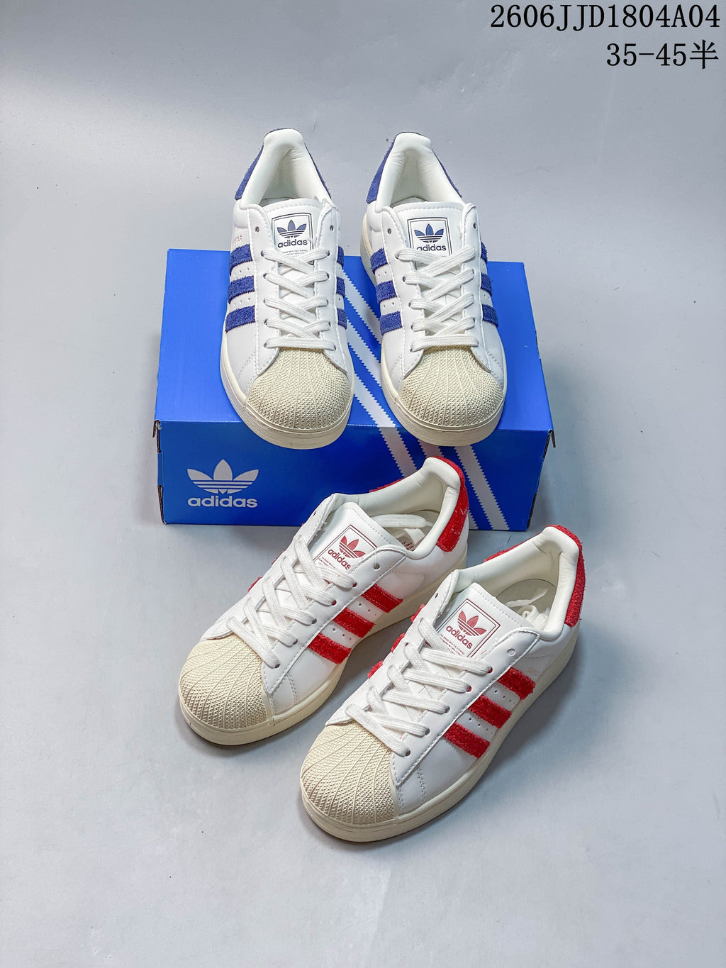 Blue- and red-accented white sneakers shown together with shell-style toes and lace-up fronts.