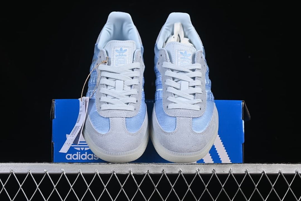 Front view of the pair displayed on a blue shoe box