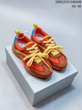 Pair of orange and brown GG-CC low-top sneakers with yellow laces and blue heel accents